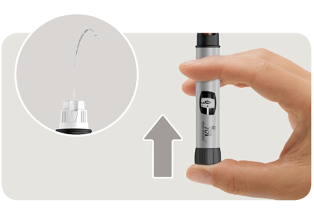 illustration of how to squirt insulin out of an insulin pen to test the needle tip