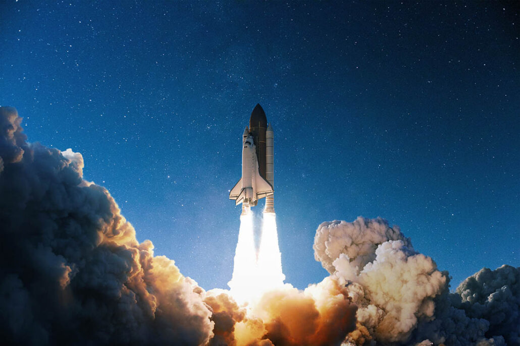rocket ship taking off straight up into the sky