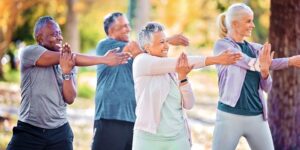 Older adults do gentle stretches in beginner exercise class for type 2 diabetes
