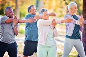 Older adults do gentle stretches in beginner exercise class for type 2 diabetes