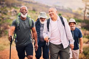 Group of senior men hiking and laughing, exercising and improving their health