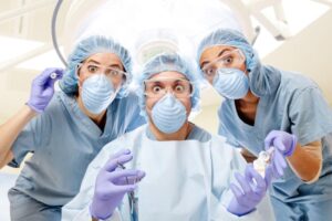 group of doctors about to treat a patient like a guinea pig in a medical experiement