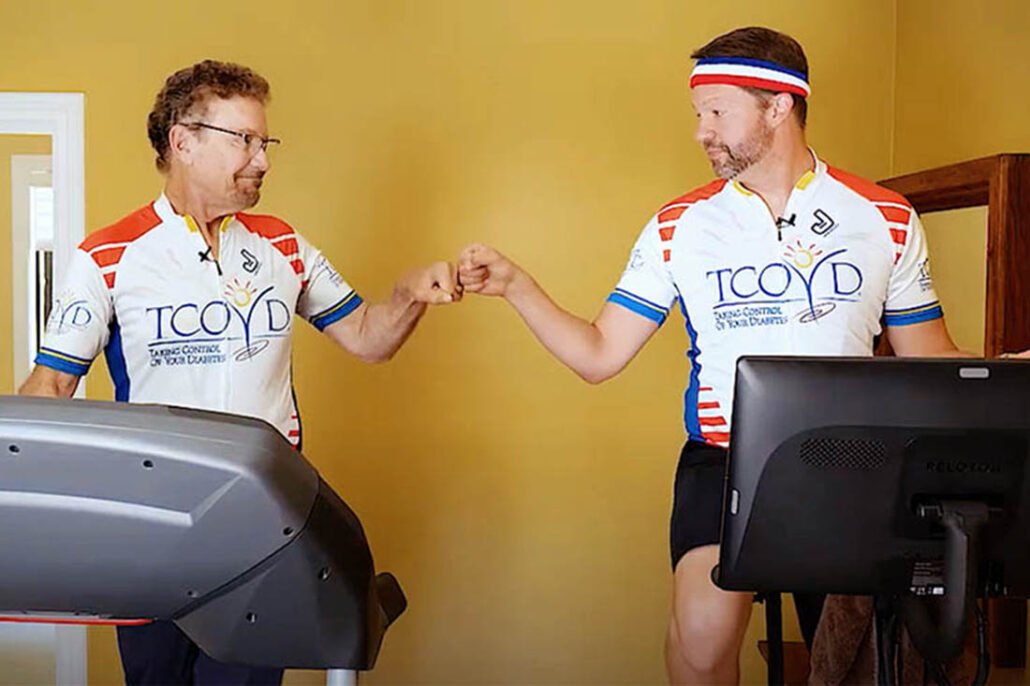 Two men with diabetes on exercise equipment before an exercise challenge