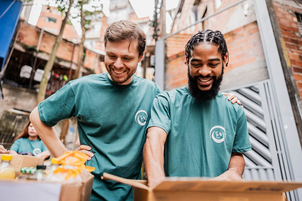 Two young men volunteering together 