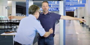 Man with diabetes getting a pat-down from TSA at the airport
