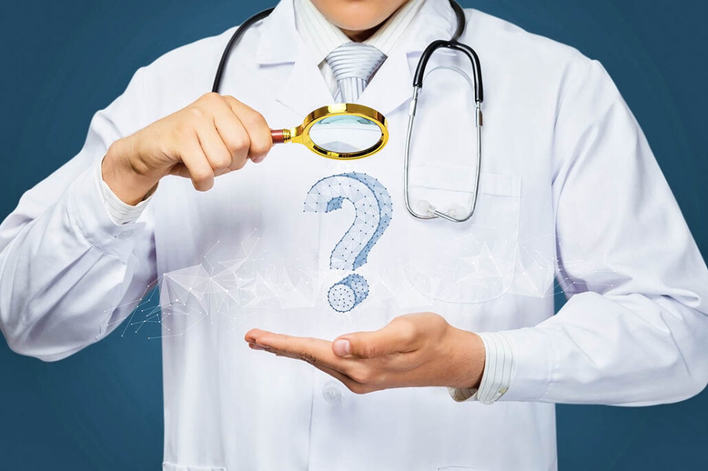 Doctor looking through a magnifying glass at a question mark, representing a challenge in trying to diagnosis symptoms related to lupus