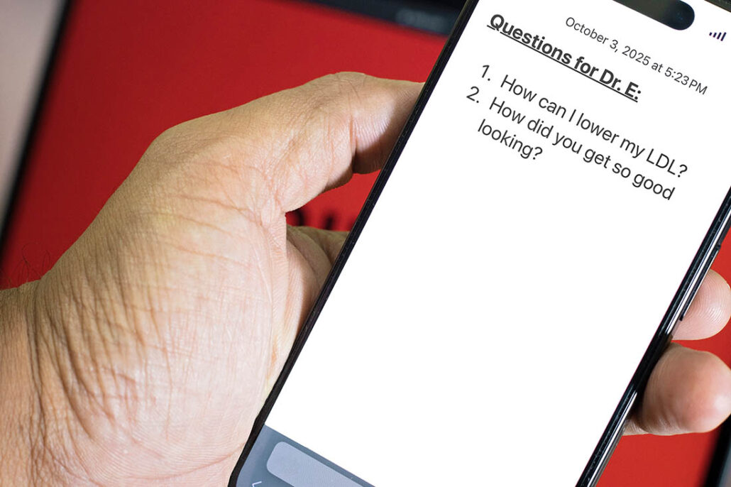 Patient with notes on his phone to ask his doctor at appointment