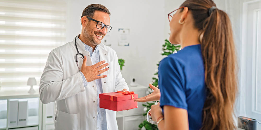 Patient giving a doctor a present