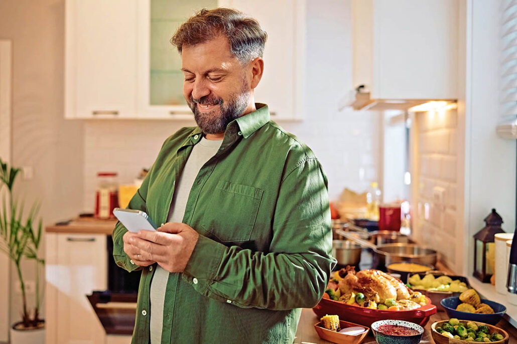 Man giving himself a prebolus of insulin before eating Thanksgiving dinner