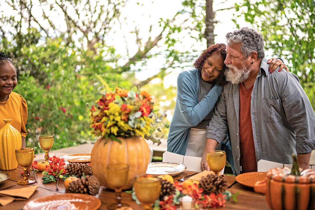 Older couple taking time to embrace during a quiet moment on Thanksgiving