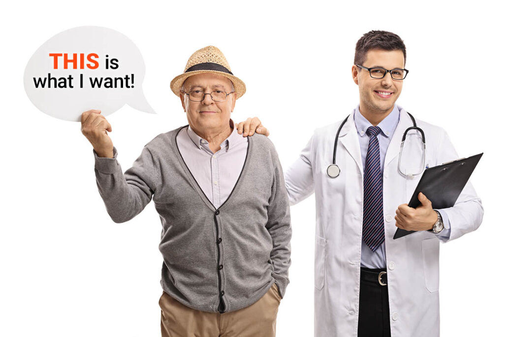 Patient holding up a sign to communicate his needs to his doctor