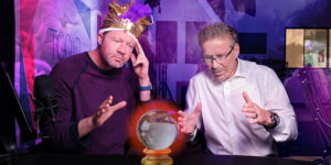 Two doctors pretending to be psychics look into a crystal ball