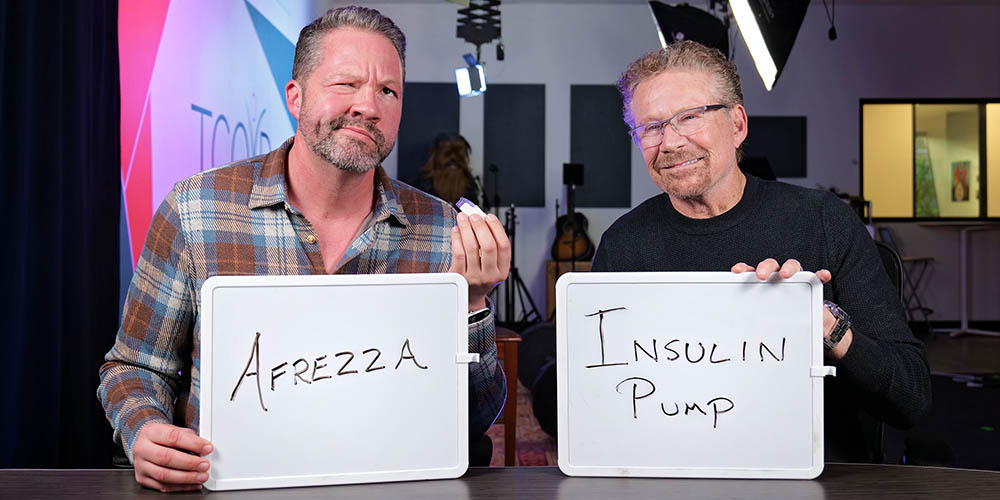 Two men hold whiteboards – one man’s whiteboard reads “Afrezza” as he holds an Afrezza inhaler device. The other man holds a board labeled “Insulin Pump.”