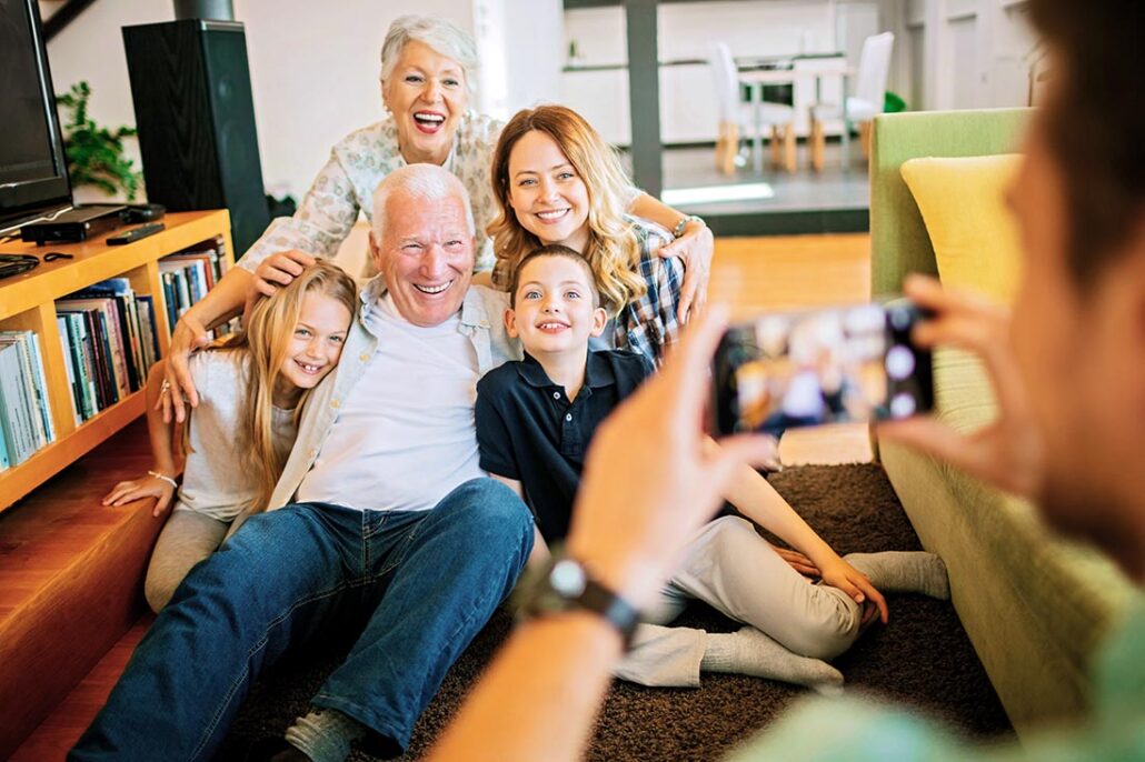 A multigenerational caucasian family poses together for a picture