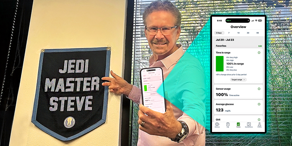 Dr. Steve Edelman stands by a "Jedi Master" sign and holds his cell phone up showing 100% time in range