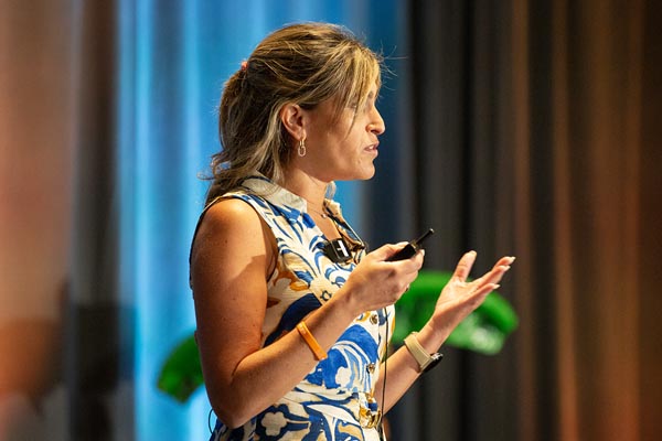A female speaker gives a talk